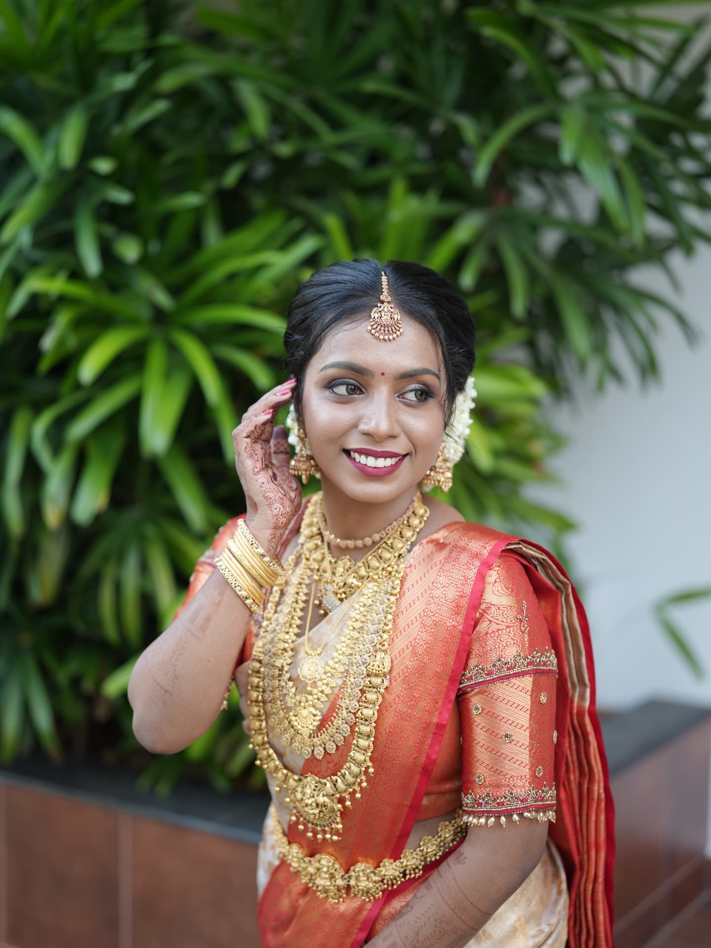 Bridal Innovation portfolio look 8, showing Kerala bridal makeup, hair styling, saree, jewellery, or ceremony details.