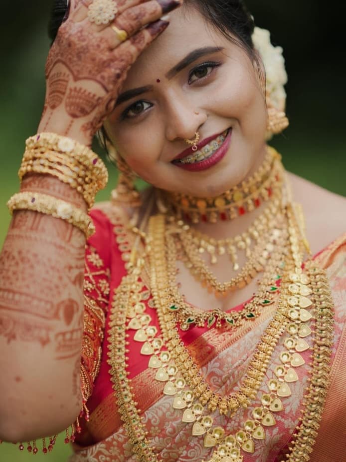 Bridal Innovation portfolio look 11, showing Kerala bridal makeup, hair styling, saree, jewellery, or ceremony details.